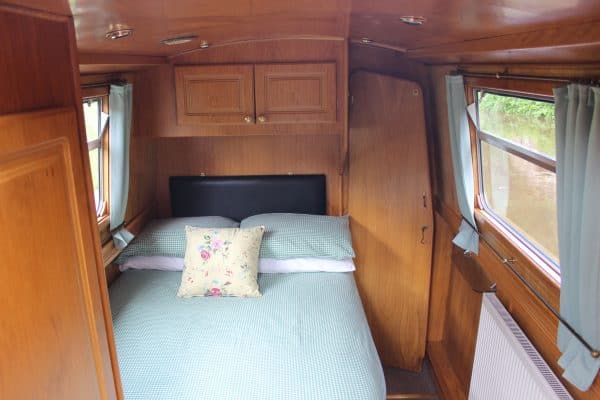 The rear cabin contains a fixed double bed
