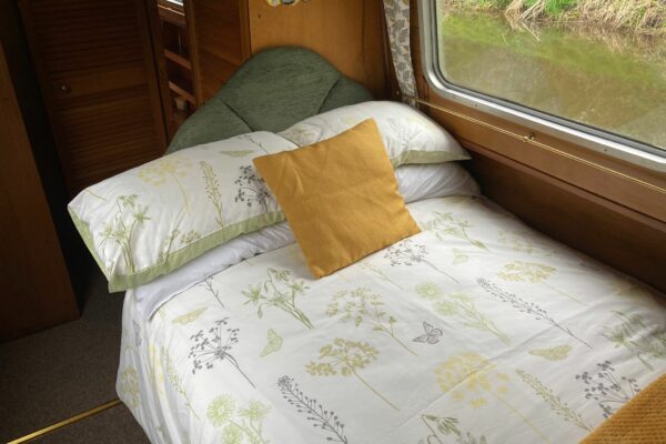 Fixed double bed on our electric boat Beaumaris Castle