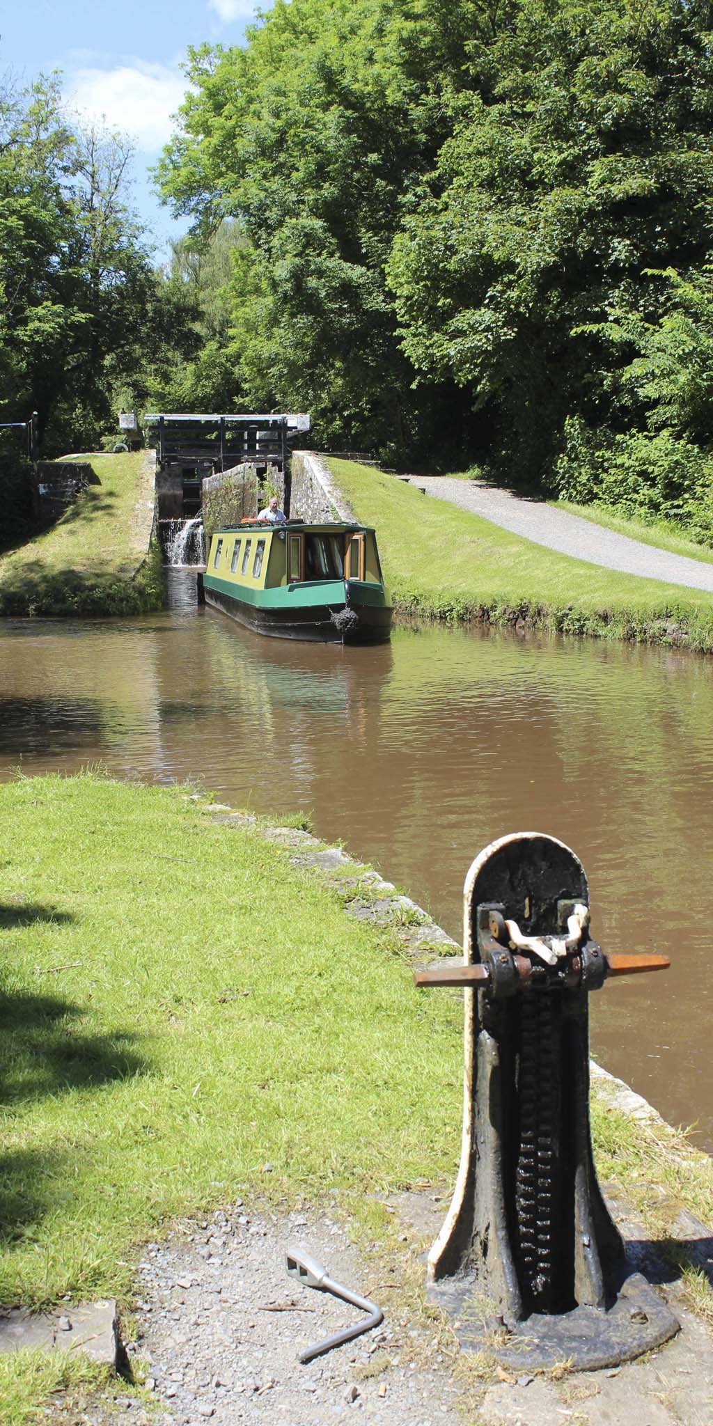 Narrow boat cruising out of a lock